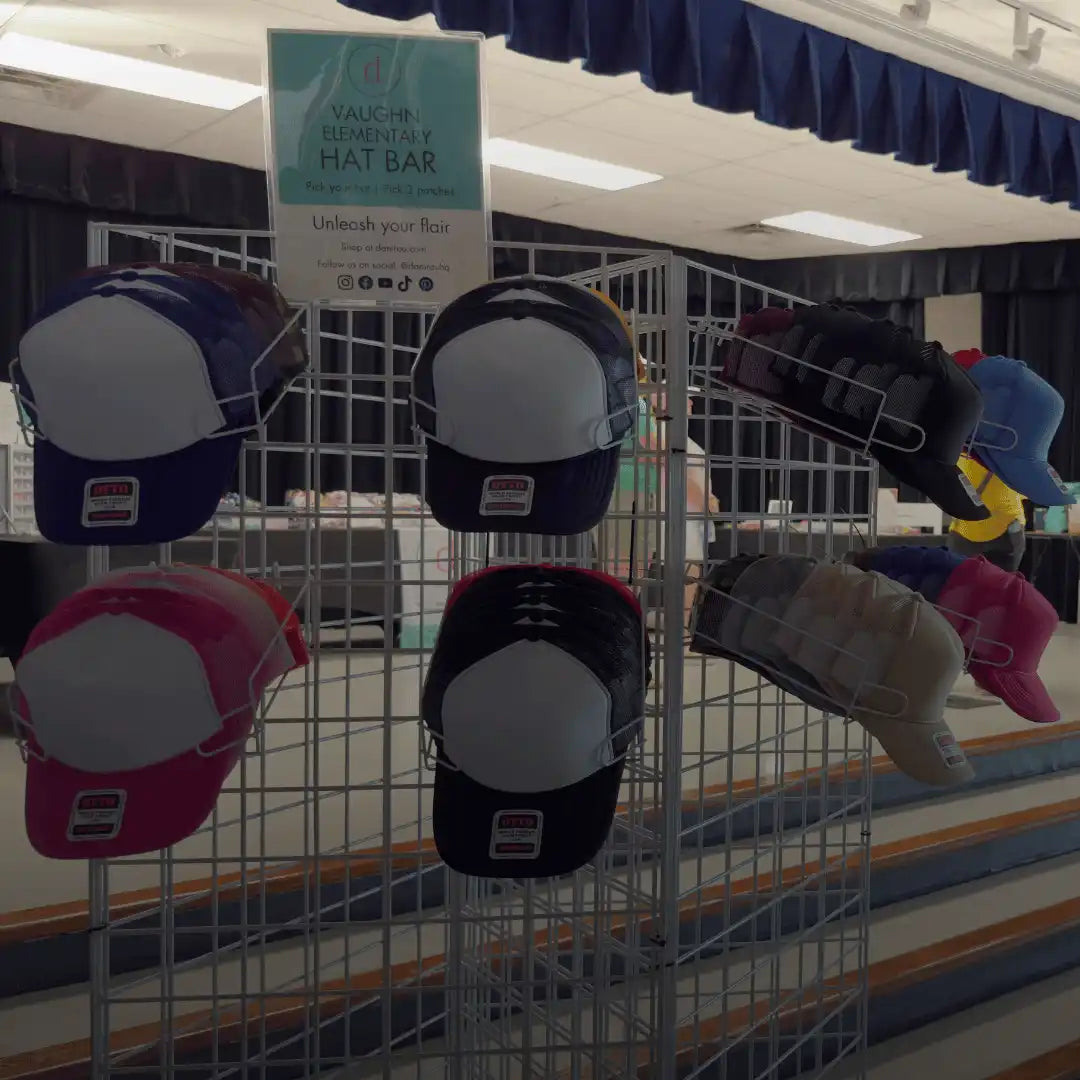 A display of various colored trucker hats on metal racks.